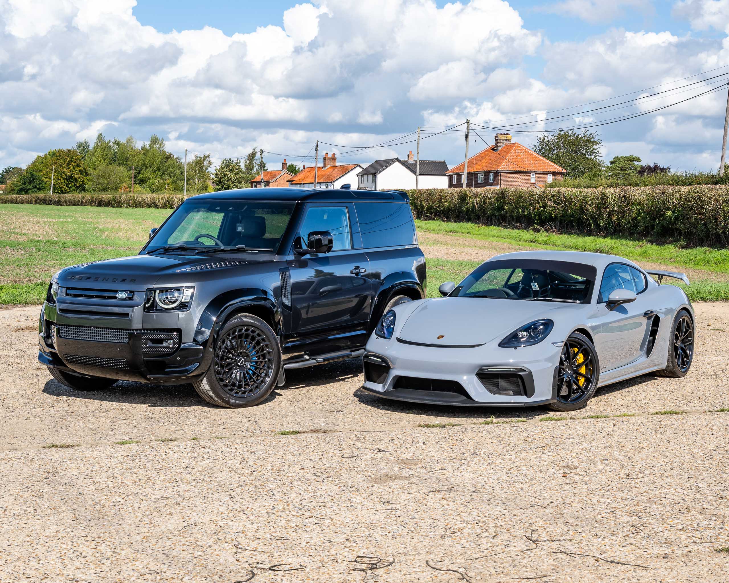 Win This Porsche 718 Cayman GT4 & Land Rover Defender 90 V8 + £2,000 Cash!